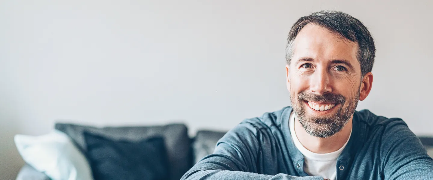 A man sitting on a couch.