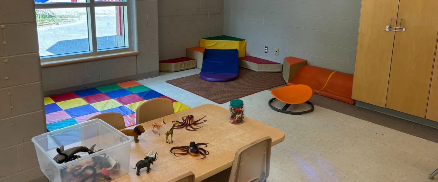 Avalon child care room. There are toy animals on a table.