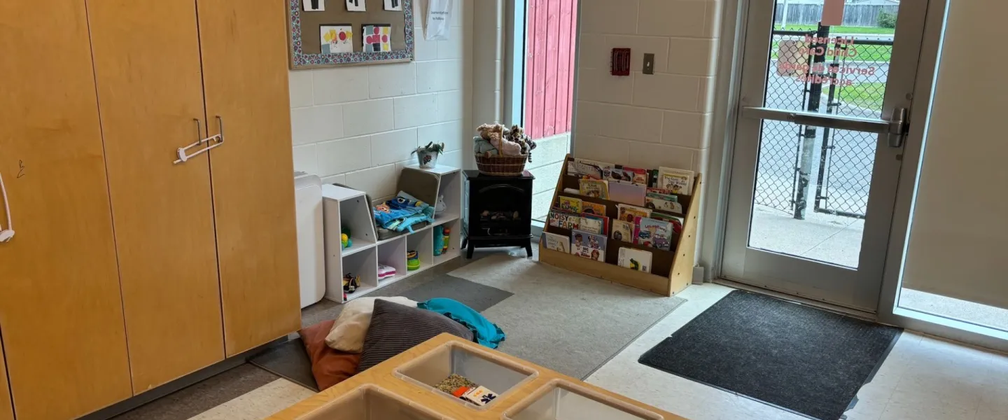 Avalon child care room corner with books and toys