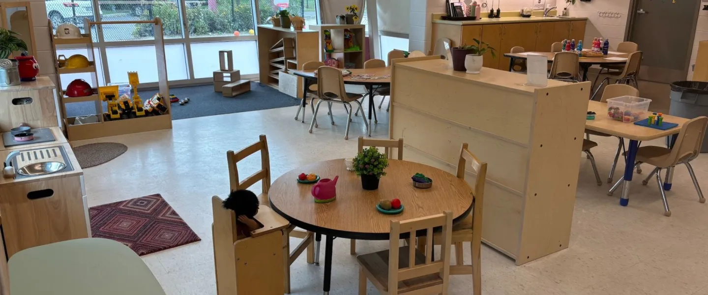 Avalon child care room with child-sized furniture and toys