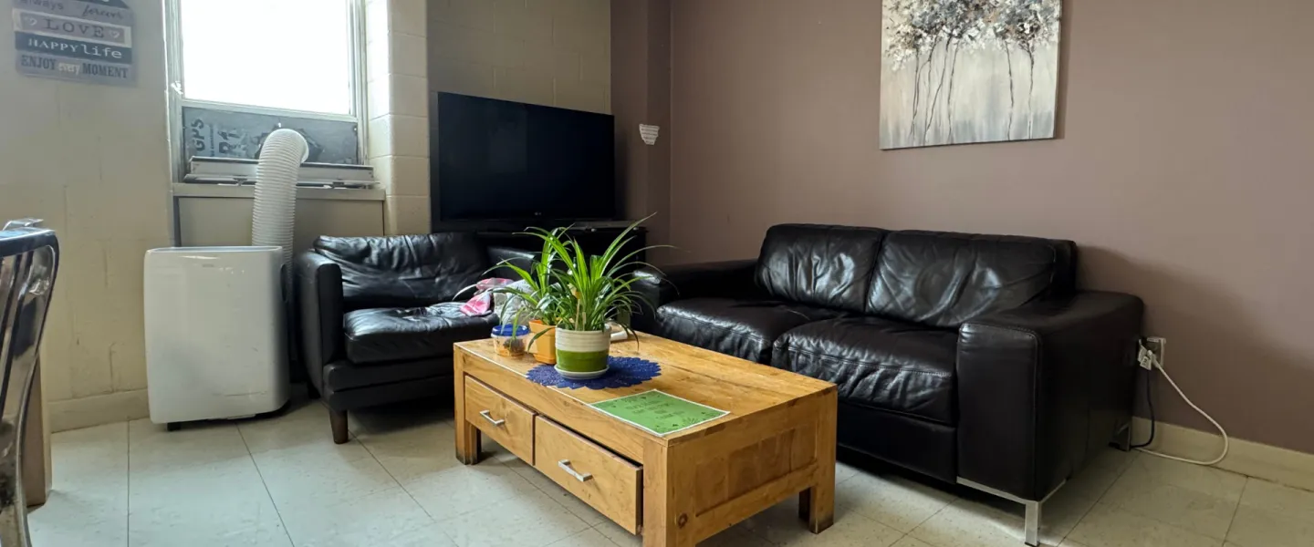 Common space with two couches, a coffee table, and a TV