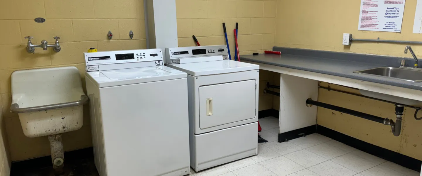 Laundry room with washer, dryer, sinks