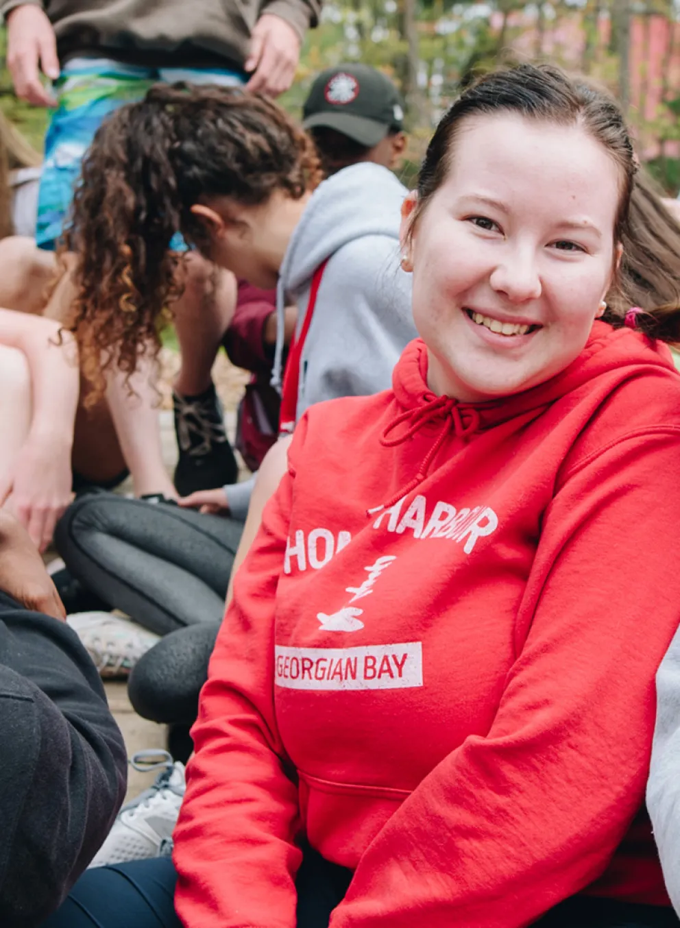 Two smiling camp councilors having fun.