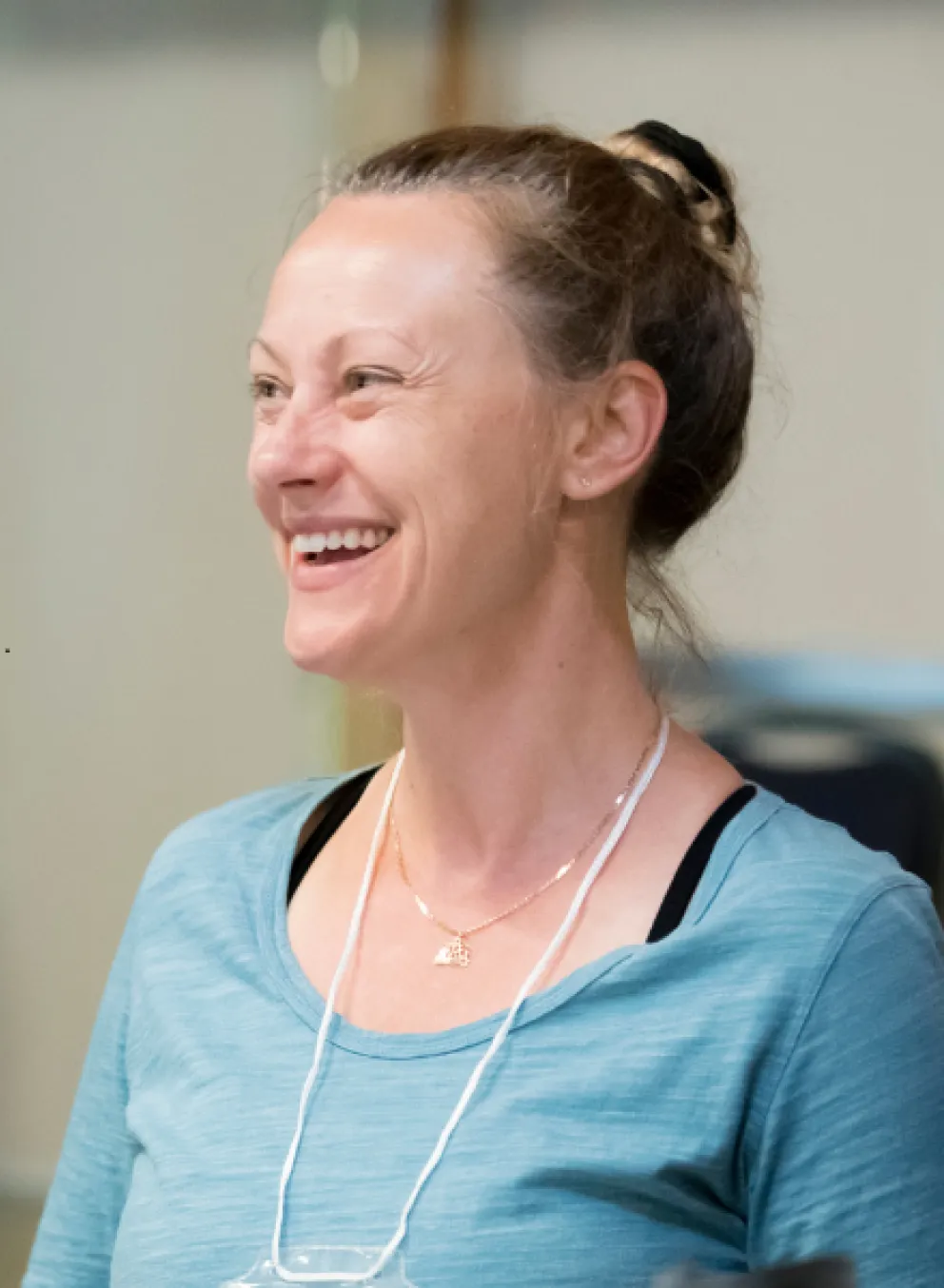 Smiling woman at a table in the Y