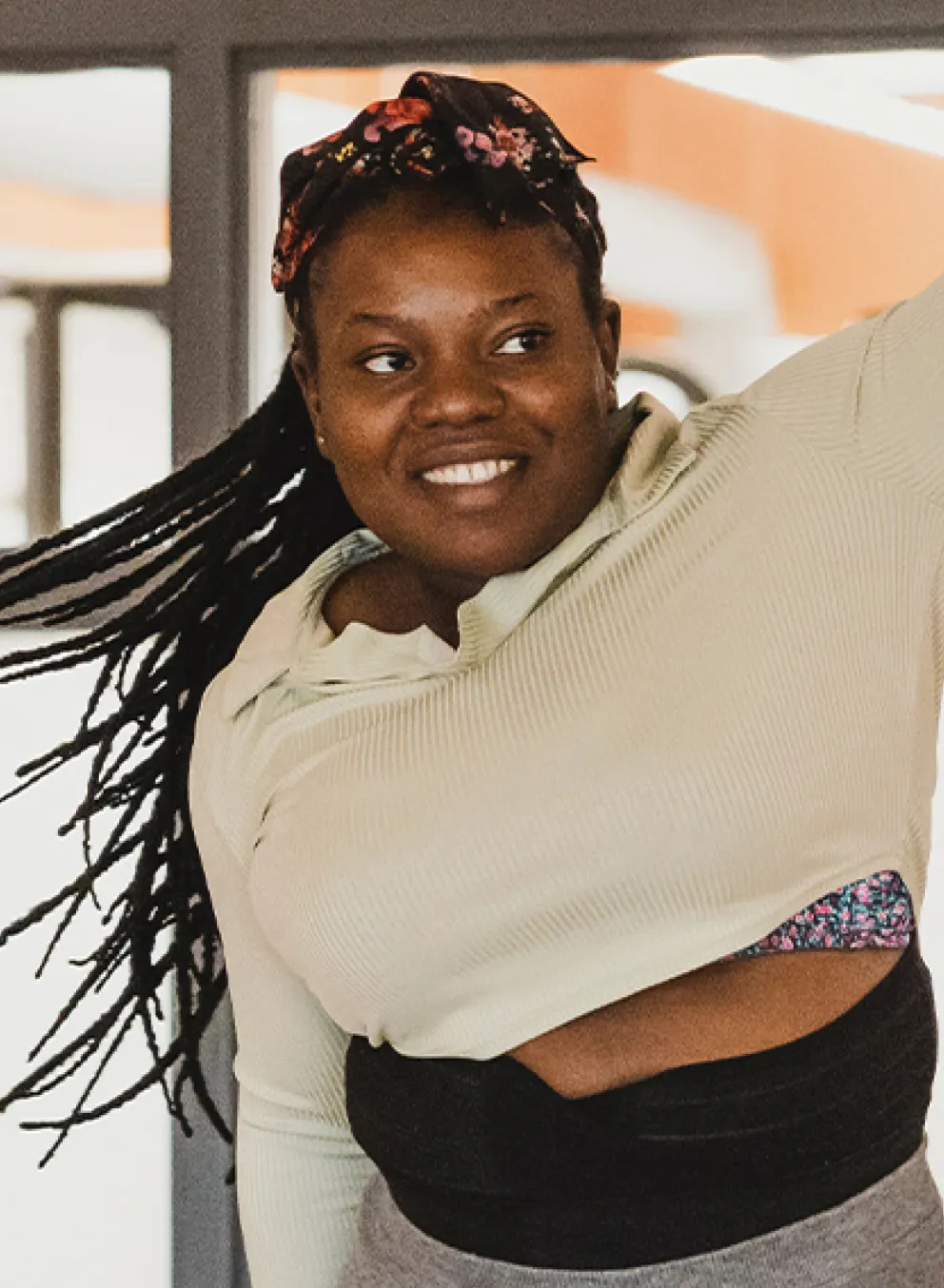 A woman participates in a group fitness class.